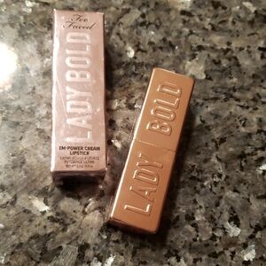 Too Faced Lady Bold Em-Power Cream Lipstick in Gold